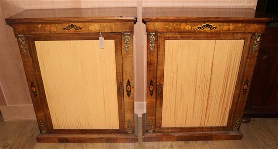 A pair of Victorian marquetry inlaid walnut pier cabinets, W.2ft 7in. D.1ft H.3ft 2in.